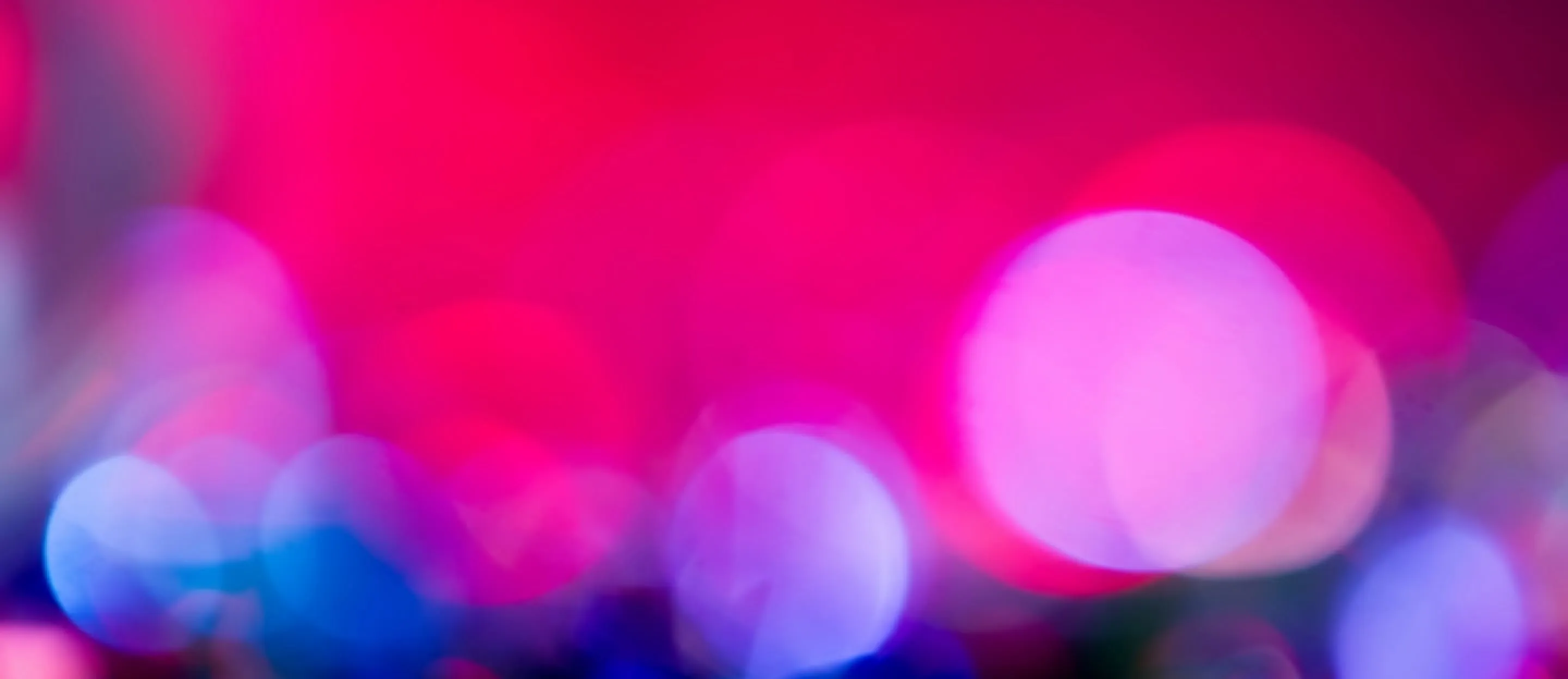 Blurry background with out-of-focus circular light spots.
